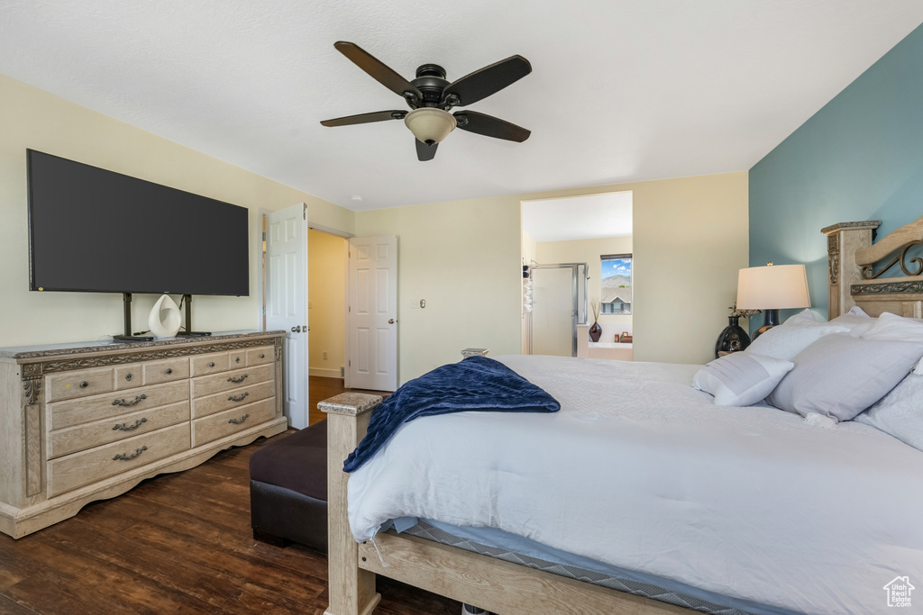 Bedroom with dark wood-type flooring and a ceiling fan