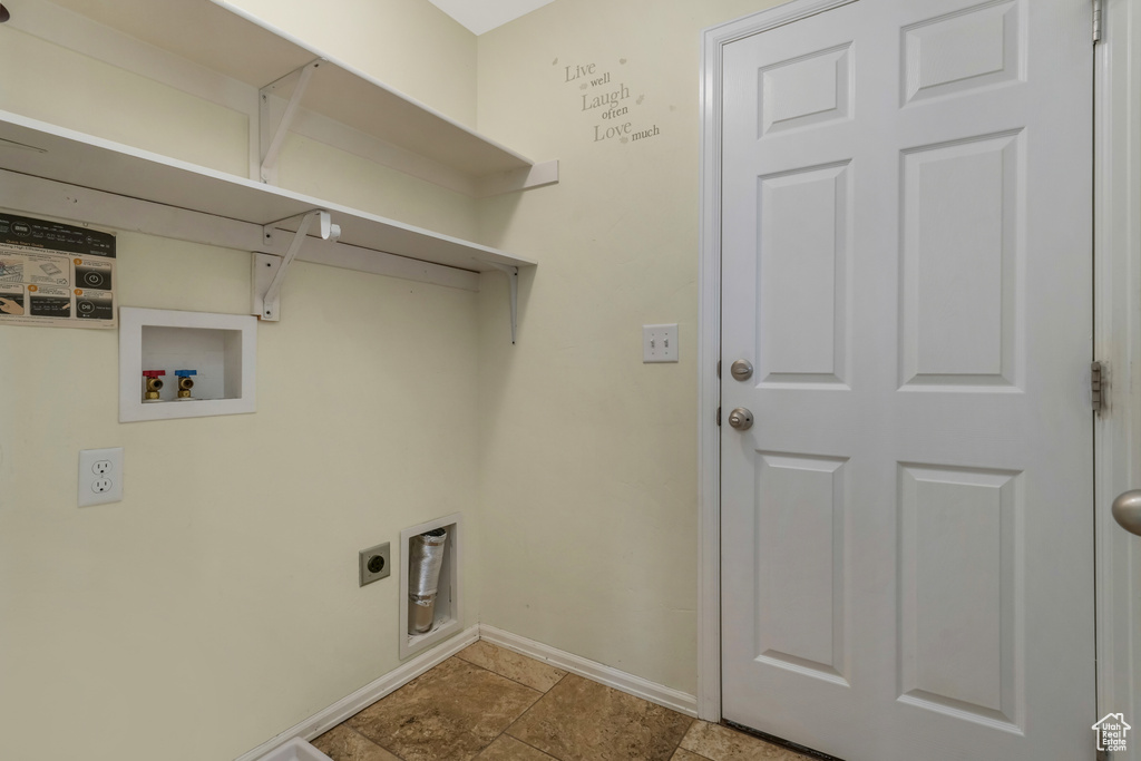 Laundry area with washer hookup and hookup for an electric dryer