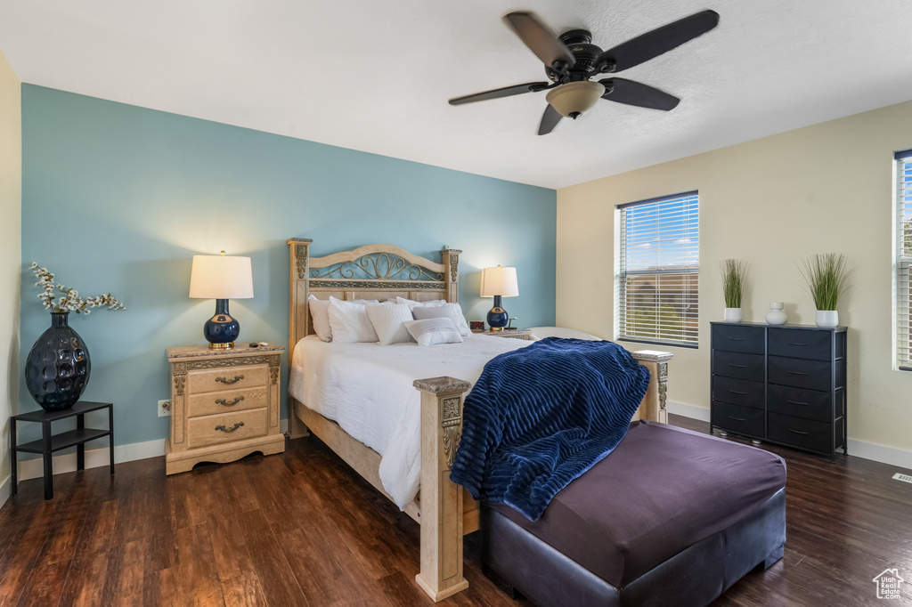 Bedroom with wood finished floors and a ceiling fan