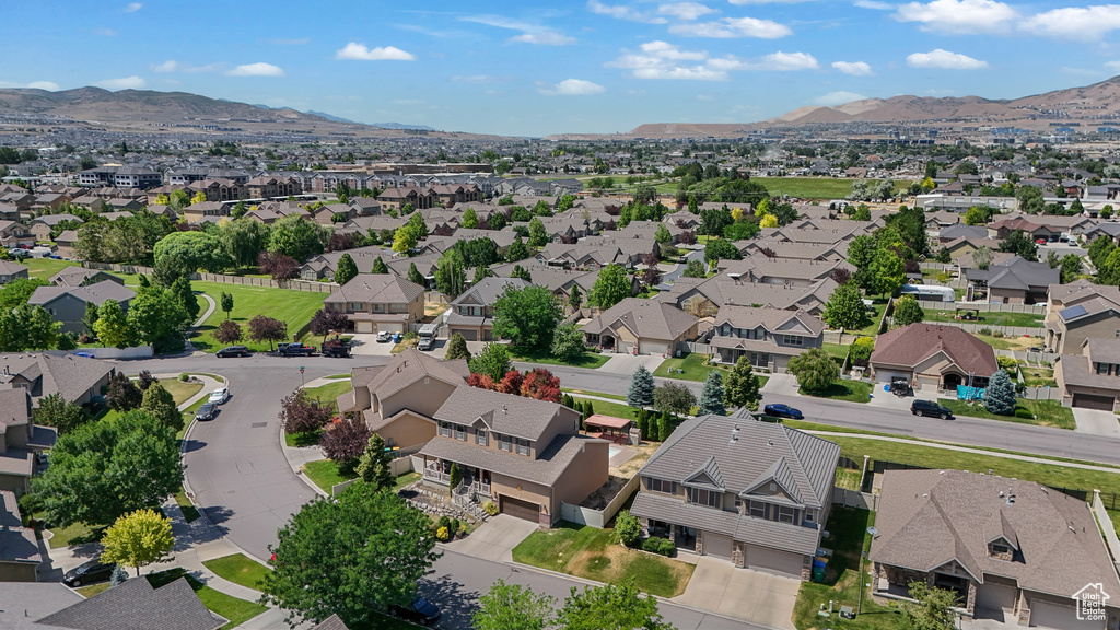 Aerial perspective of suburban area with a mountainous background
