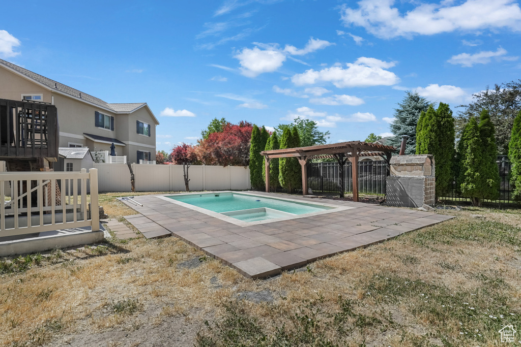 View of swimming pool with a pergola, a fenced backyard, and a patio area
