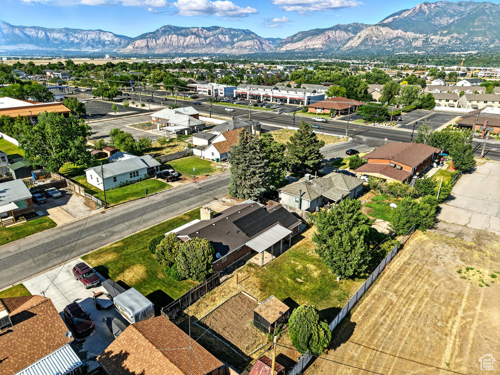 Aerial perspective of suburban area with a mountainous background