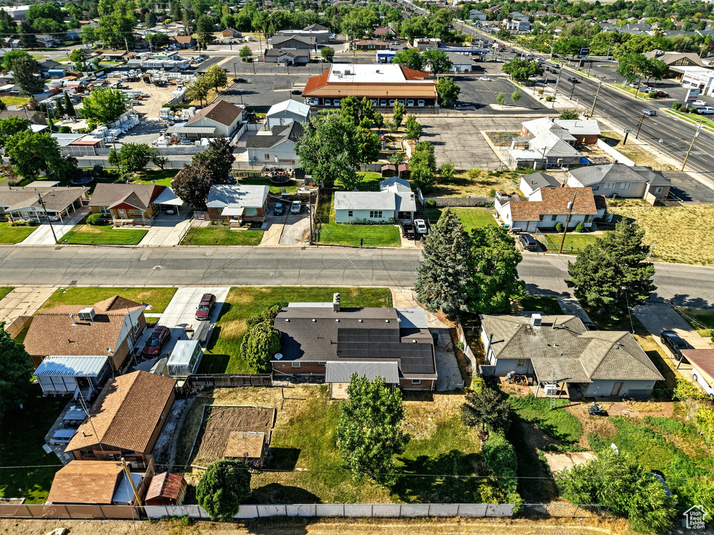 Aerial view of property's location with nearby suburban area