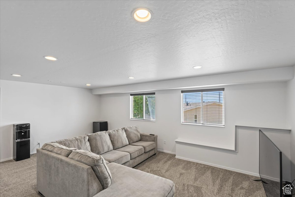 Living room with carpet flooring and recessed lighting