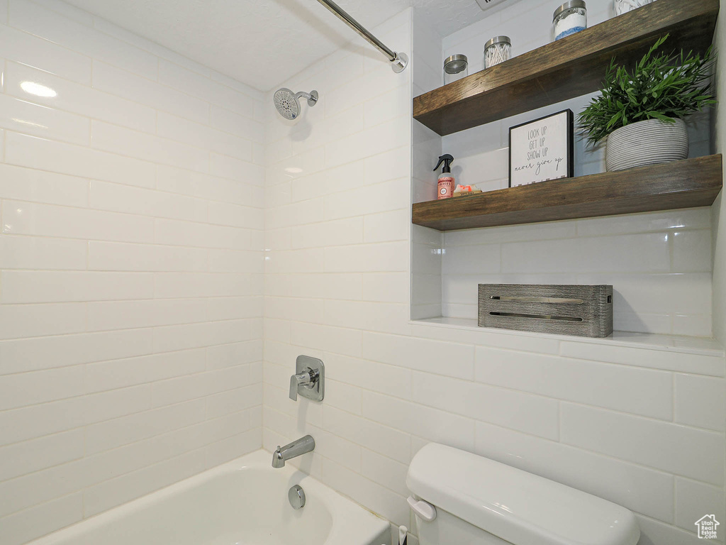Full bathroom with toilet and shower / tub combination