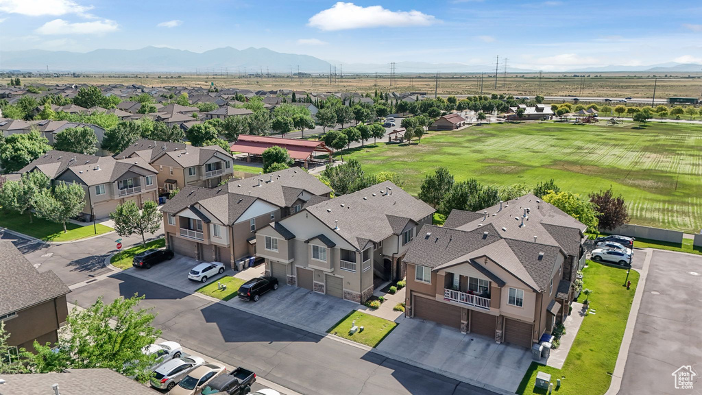 Aerial perspective of suburban area featuring a mountain backdrop