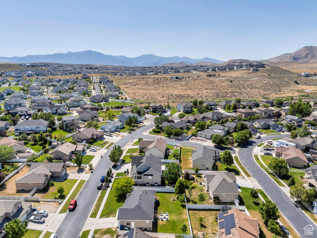 Aerial view of residential area with a mountainous background
