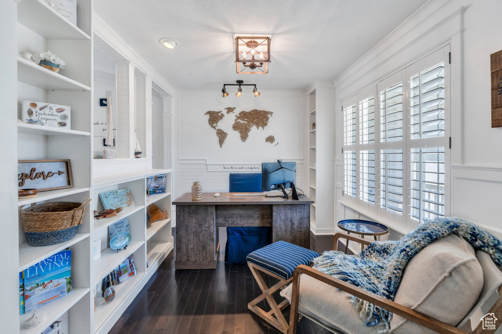 Home office featuring wood finished floors and ornamental molding