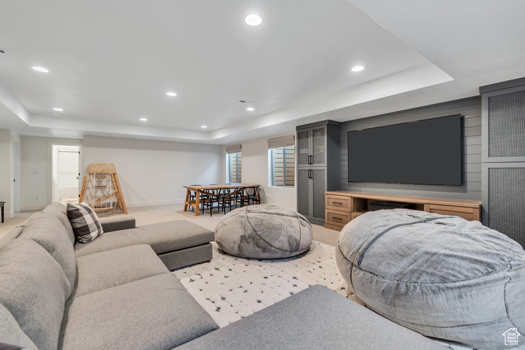 Living room with a raised ceiling and recessed lighting
