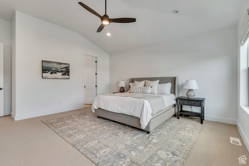 Bedroom featuring light carpet, vaulted ceiling, a ceiling fan, and recessed lighting