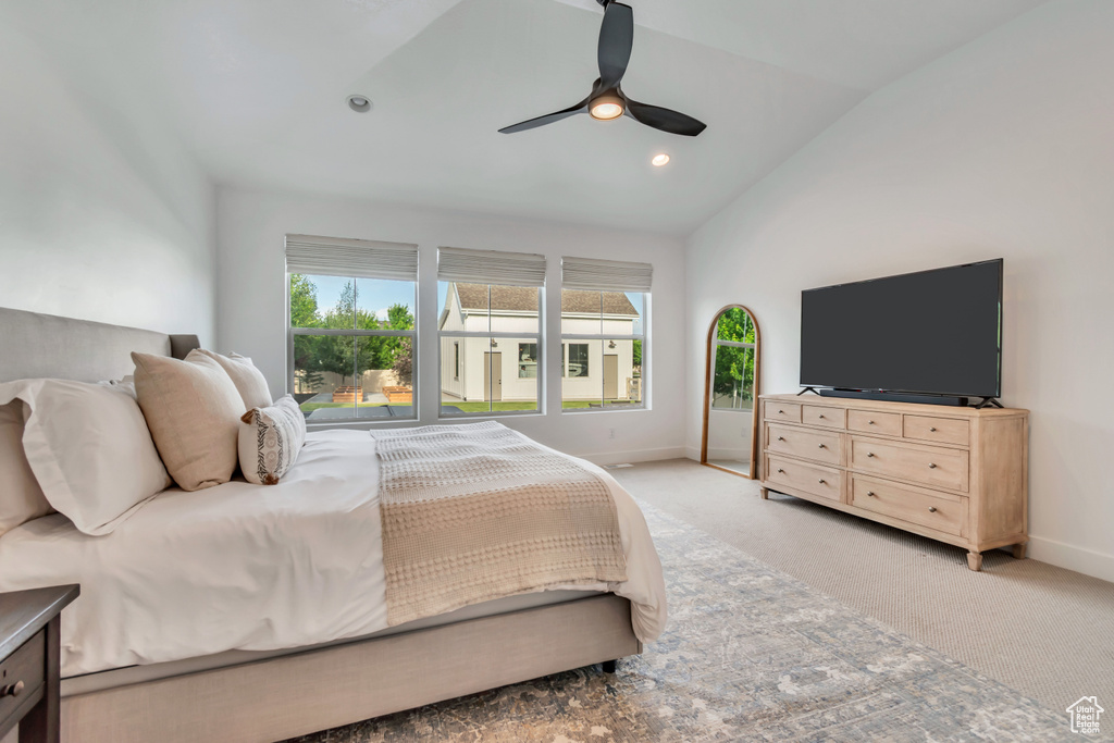 Bedroom with vaulted ceiling, light carpet, a ceiling fan, and recessed lighting