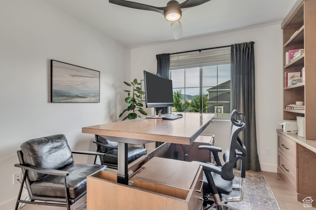 Office featuring ceiling fan and light wood-style floors