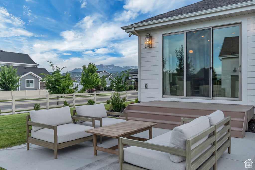 View of patio / terrace featuring a mountain view and an outdoor living space