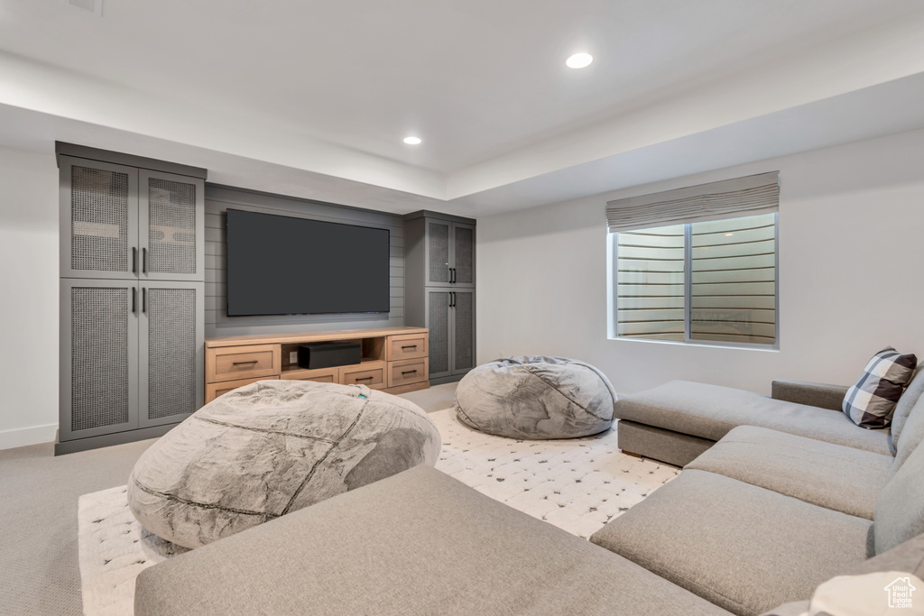 Living room with recessed lighting and light colored carpet