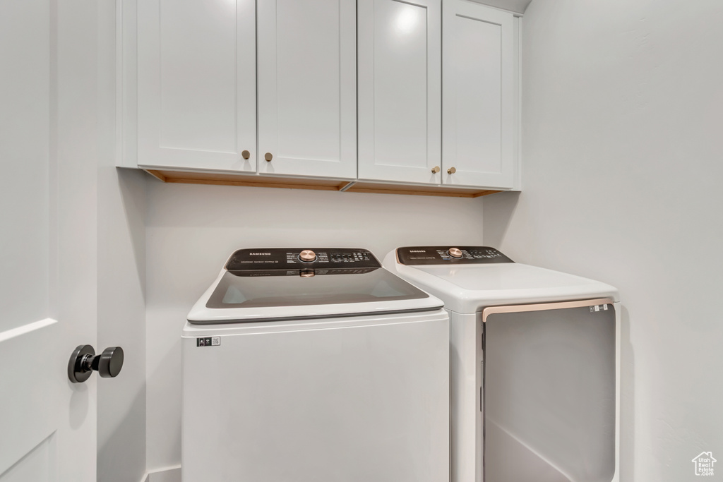 Laundry area with washer and dryer and cabinet space