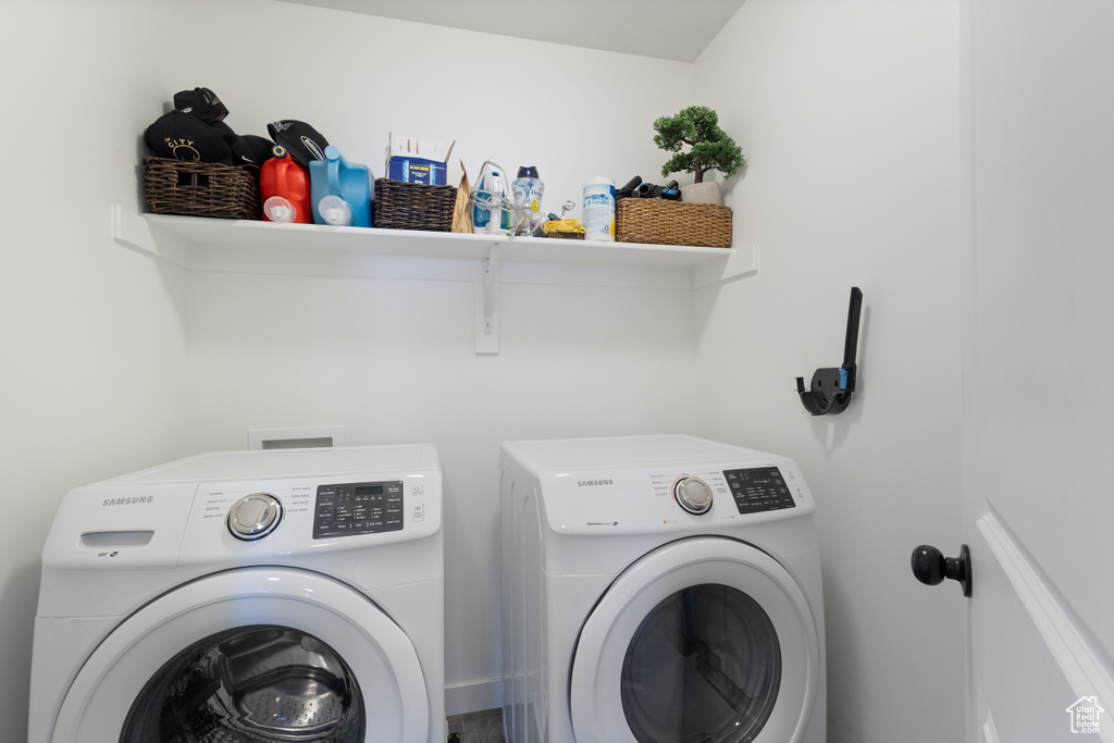 Laundry area with washing machine and clothes dryer