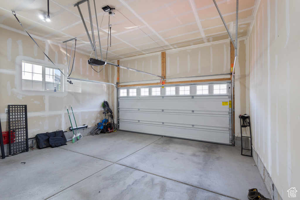Garage featuring a garage door opener