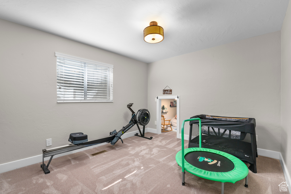 Workout room featuring carpet flooring