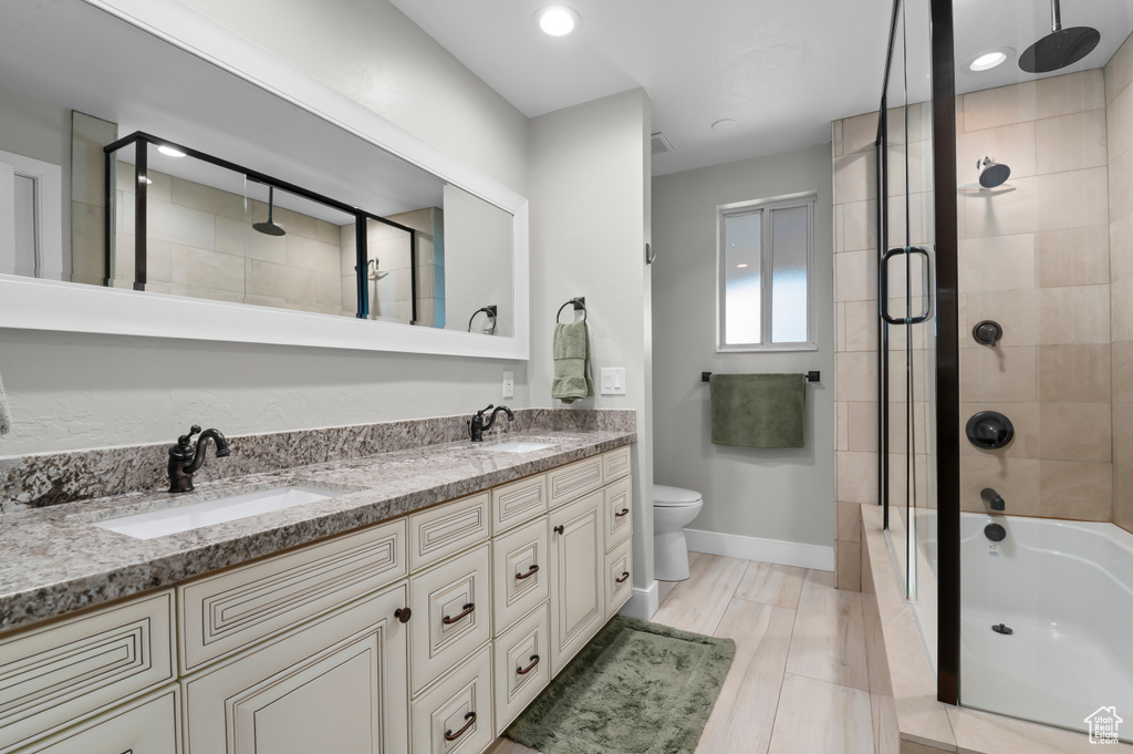 Full bath with double vanity and recessed lighting