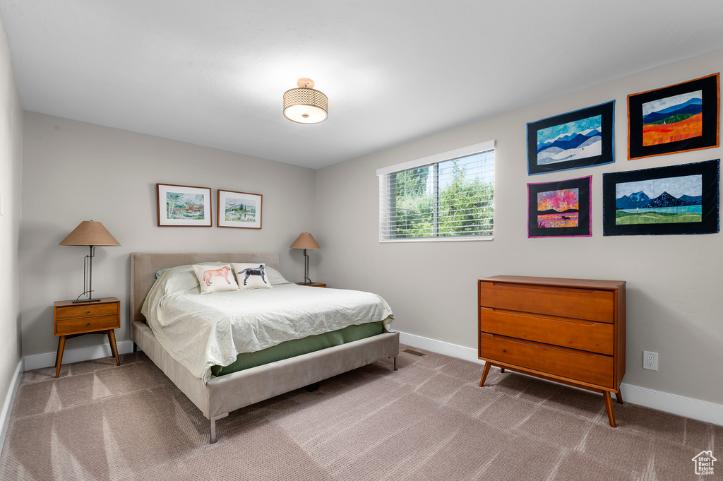 Carpeted bedroom with baseboards
