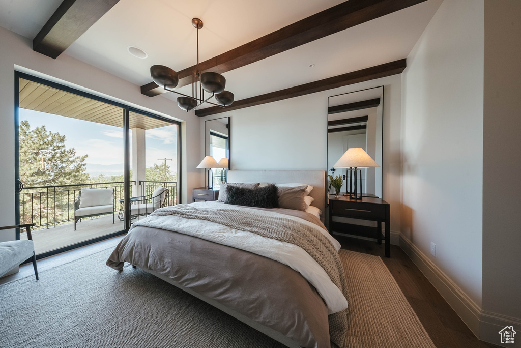 Bedroom featuring a chandelier, access to outside, beam ceiling, and wood finished floors