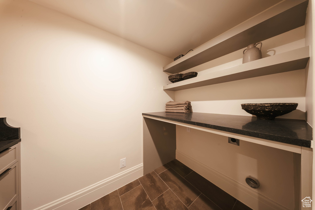 Interior space featuring cabinet space and wood tiled floors