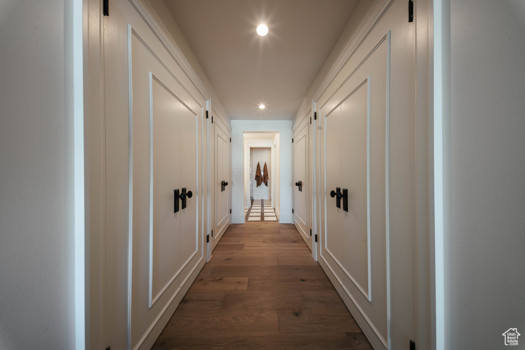 Corridor featuring recessed lighting and dark wood-style flooring