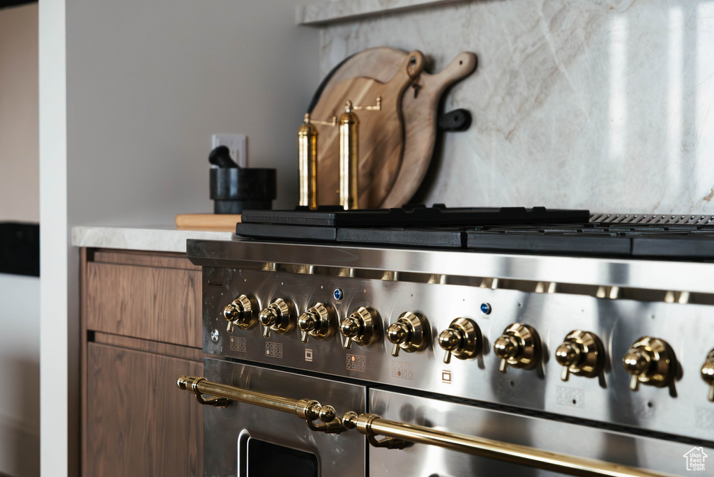 Kitchen view of stainless steel gas range oven