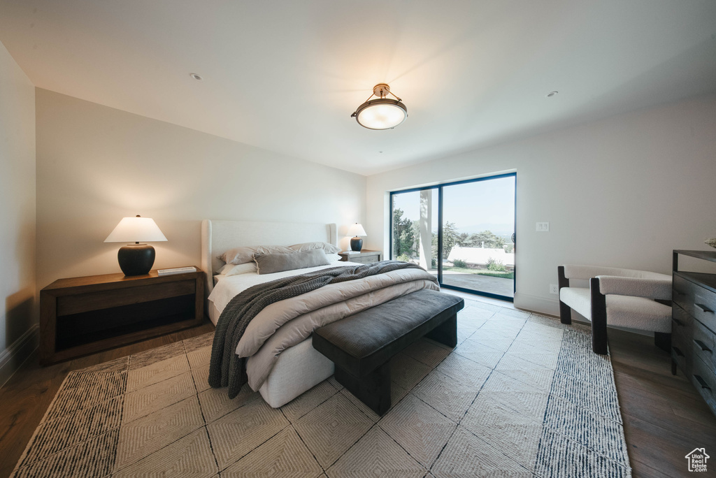 Bedroom featuring access to outside and wood finished floors