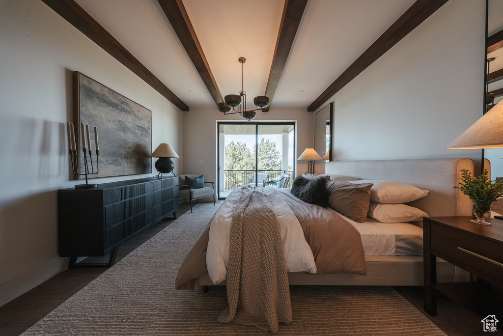Bedroom with beam ceiling, access to outside, and a chandelier