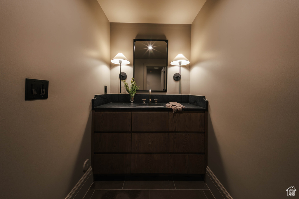 Bathroom featuring tile patterned floors and vanity