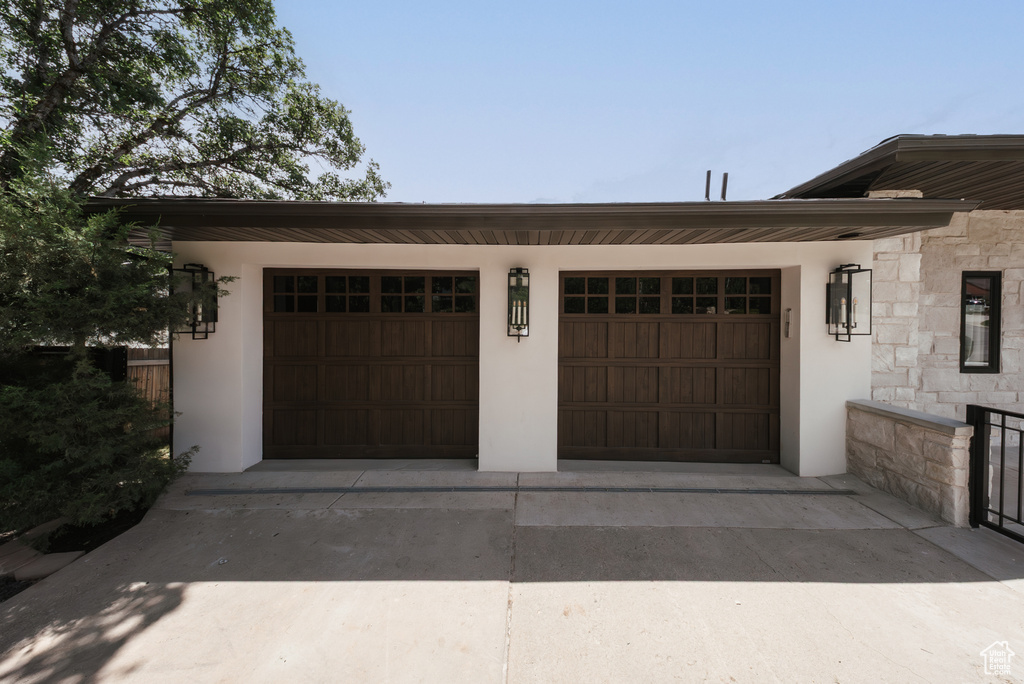 Garage with concrete driveway