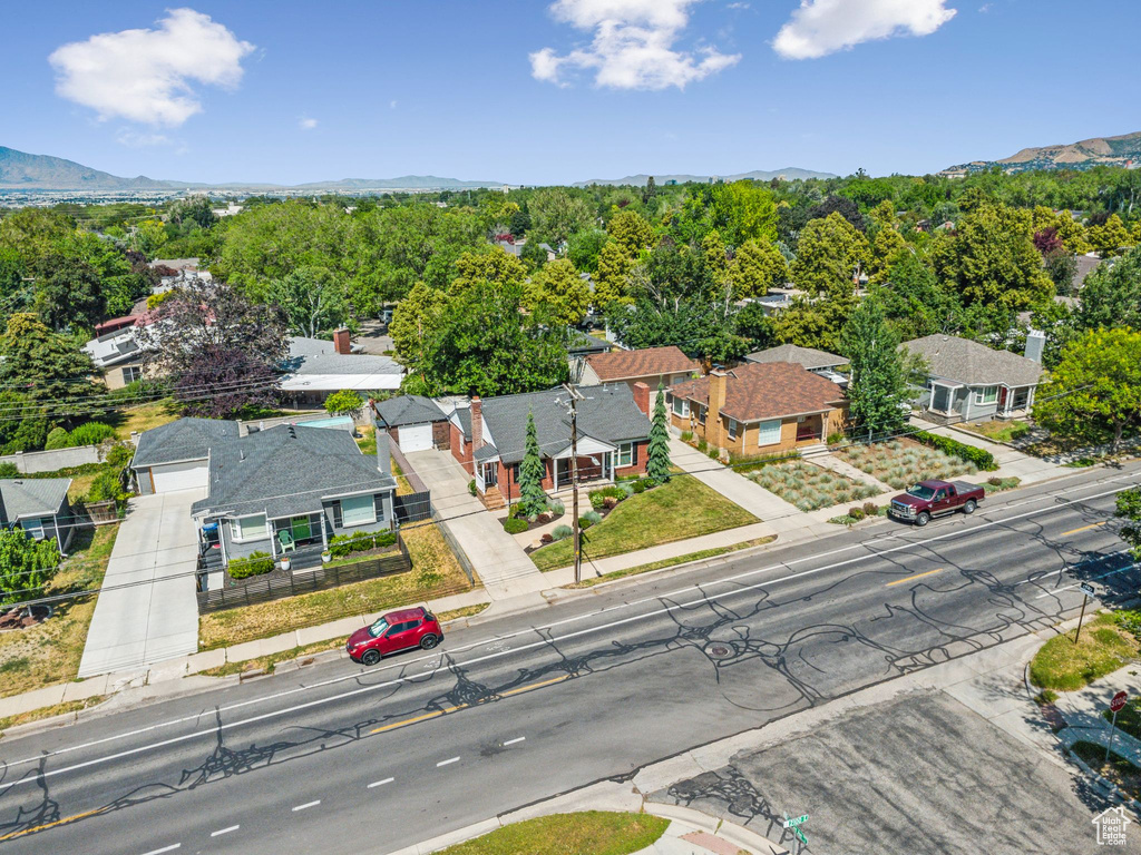 Aerial view of residential area featuring a mountainous background