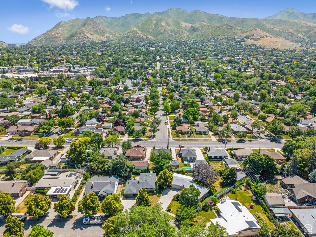 Aerial perspective of suburban area featuring a mountainous background