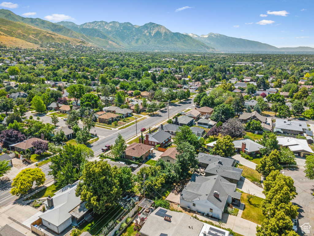 Aerial perspective of suburban area with a mountainous background