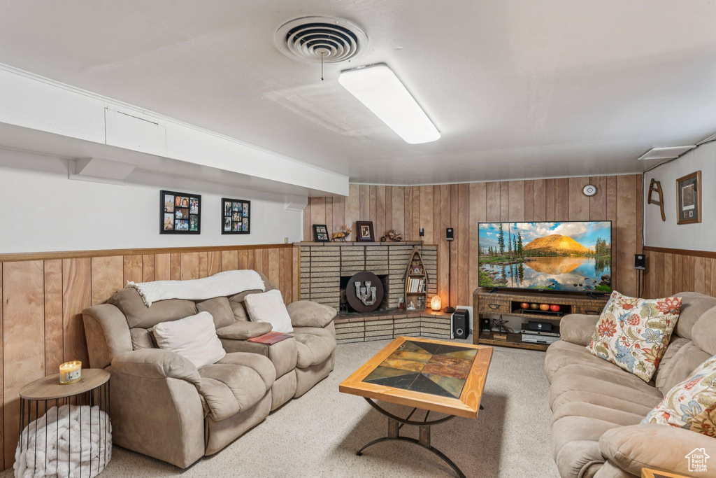 Living room with wooden walls and a wainscoted wall