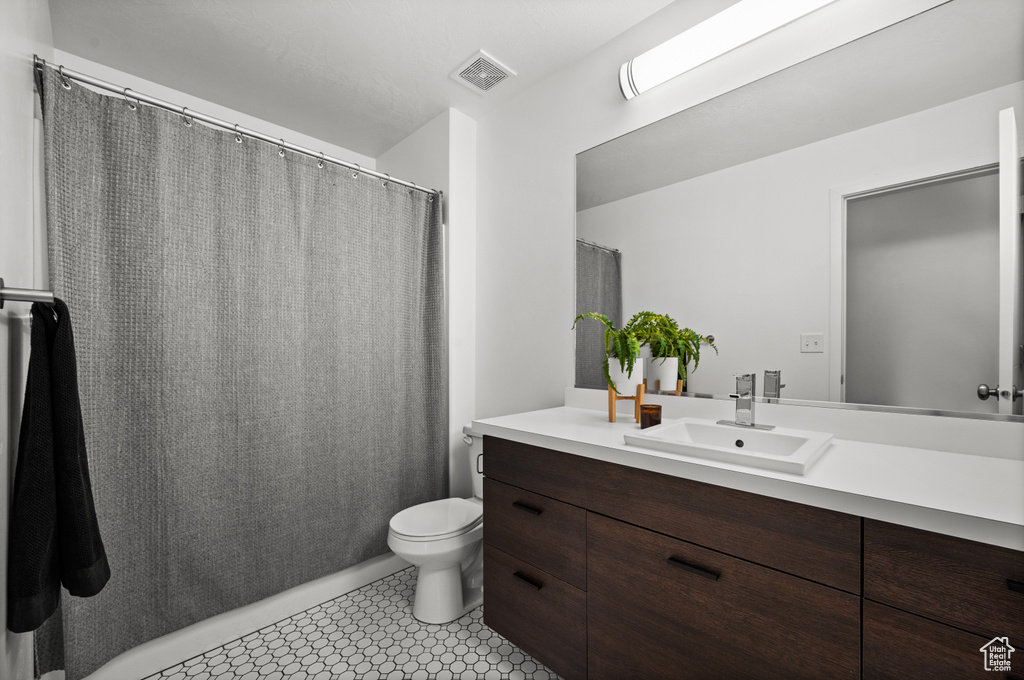 Bathroom with vanity and toilet