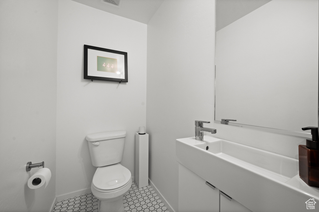 Half bath with toilet and vanity