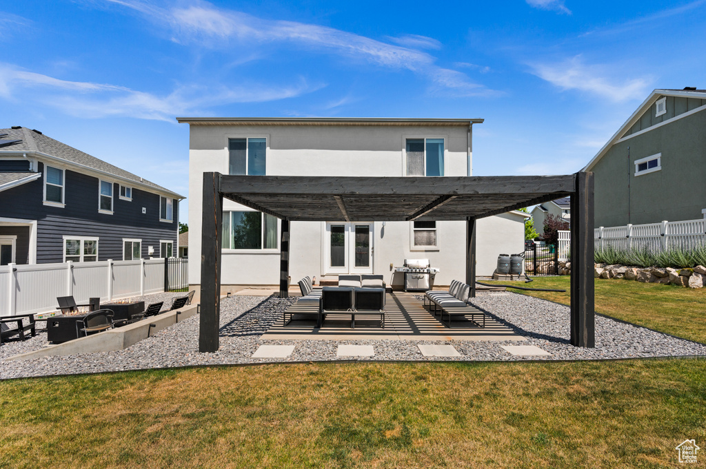 Back of house with outdoor lounge area, a patio, stucco siding, and a pergola