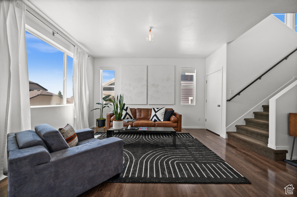 Living area with stairs and wood finished floors