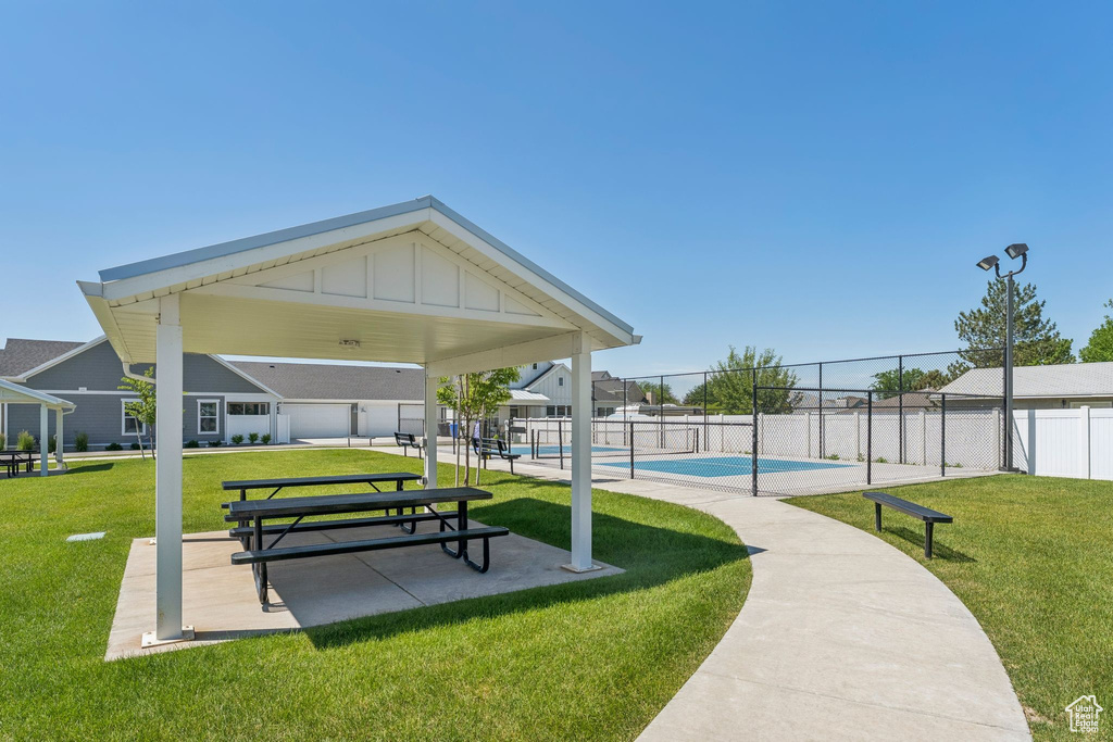 View of community featuring a swimming pool and a patio