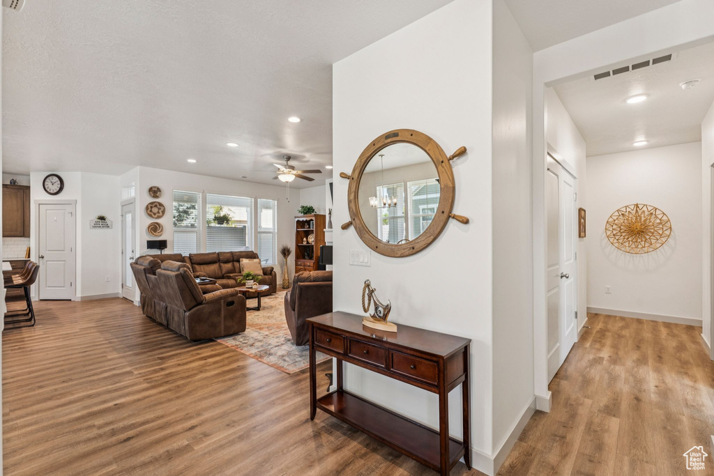 Living area featuring light wood-type flooring, recessed lighting, and ceiling fan
