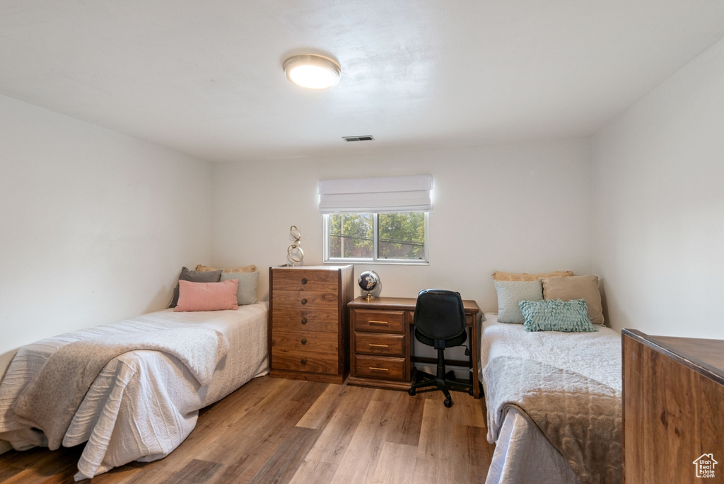 Bedroom featuring wood finished floors
