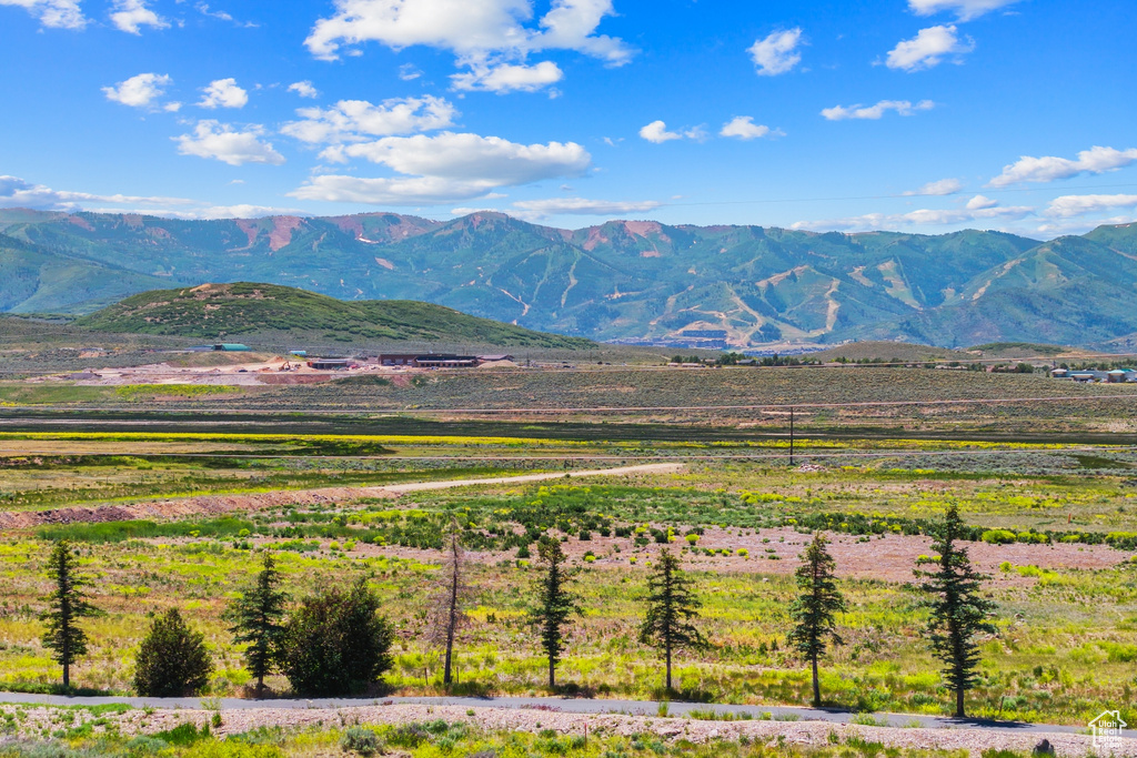View of mountain background featuring rural landscape