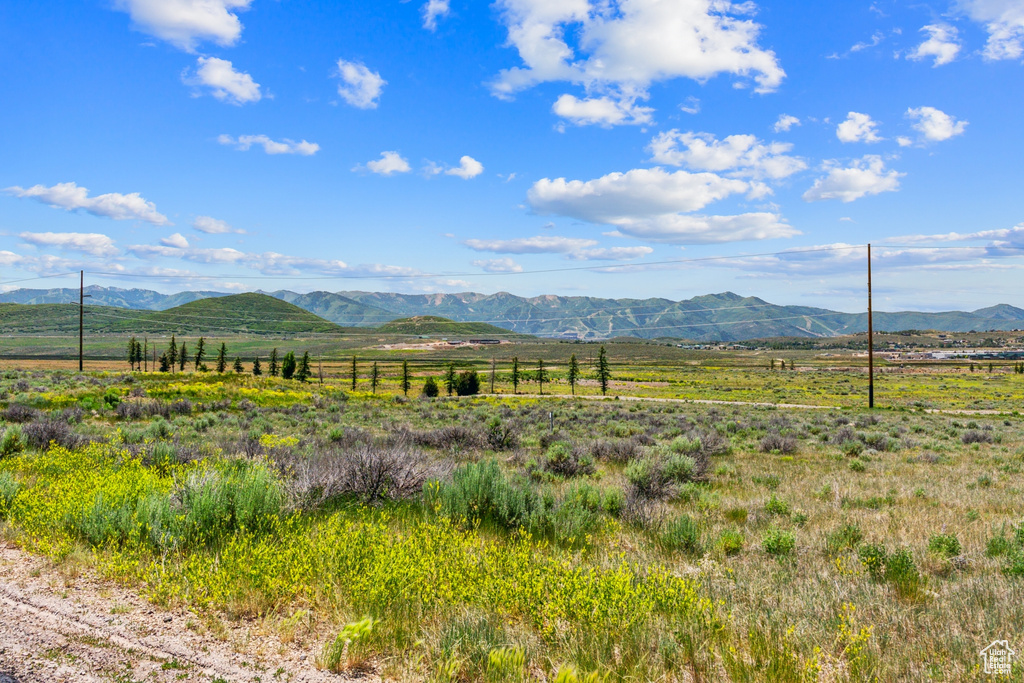 View of mountain backdrop with rural landscape
