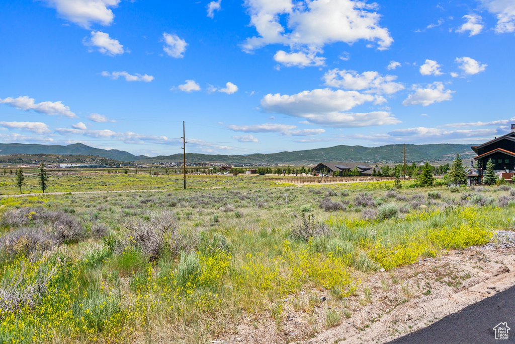 View of mountain background featuring rural landscape