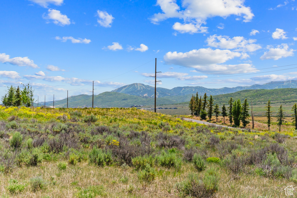 View of mountain background featuring rural landscape