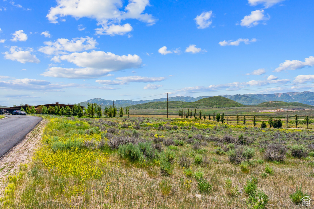 View of mountain background featuring rural landscape