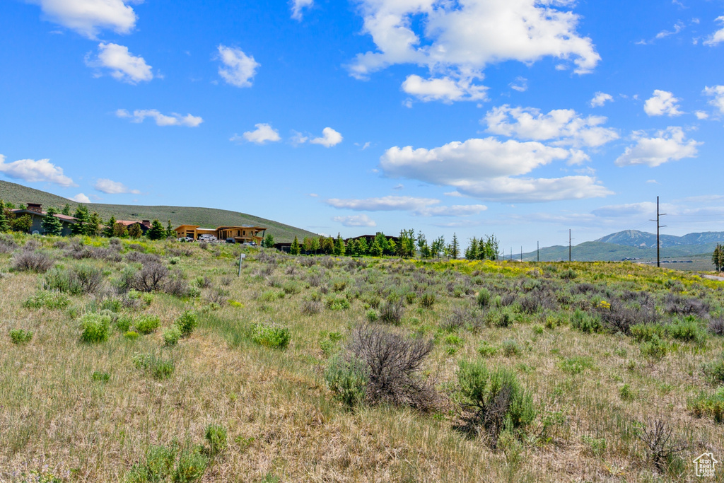 View of mountain background featuring rural landscape