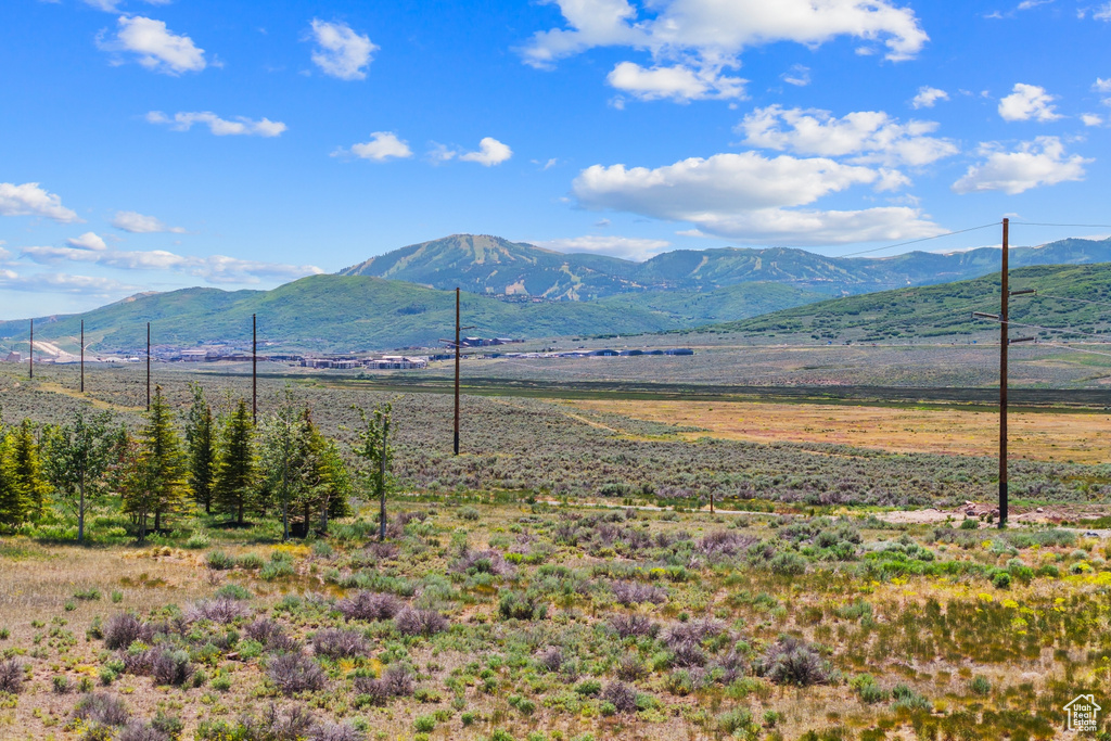 View of mountain backdrop featuring rural landscape